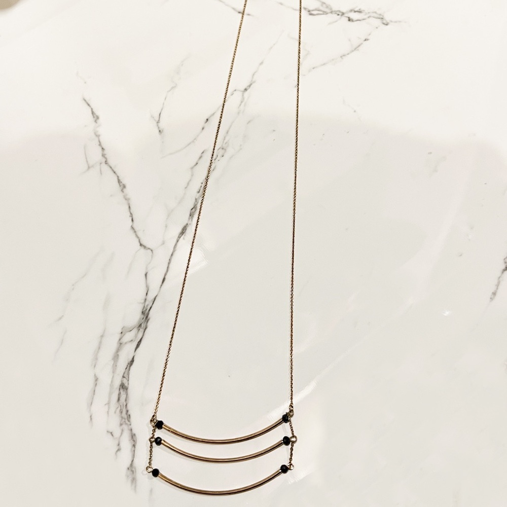 Long gold and gem necklace